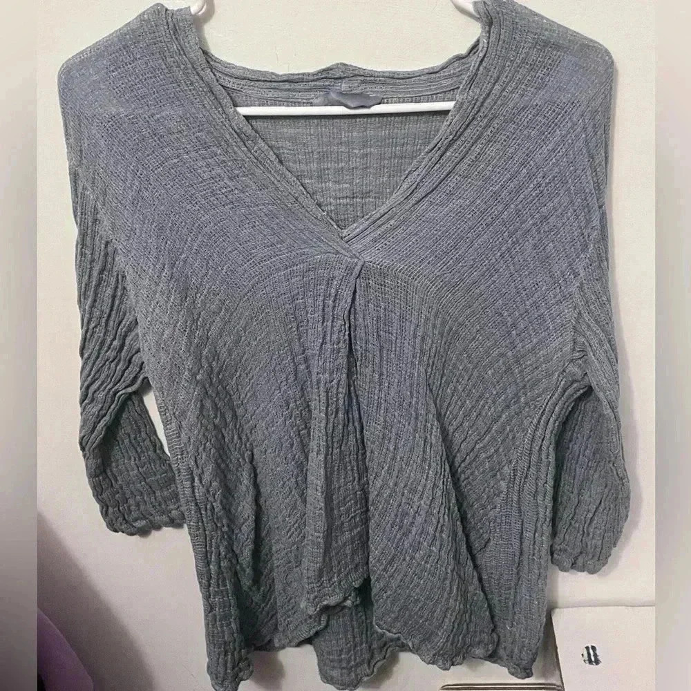 Woman’s light blue / cardigan top / sweater